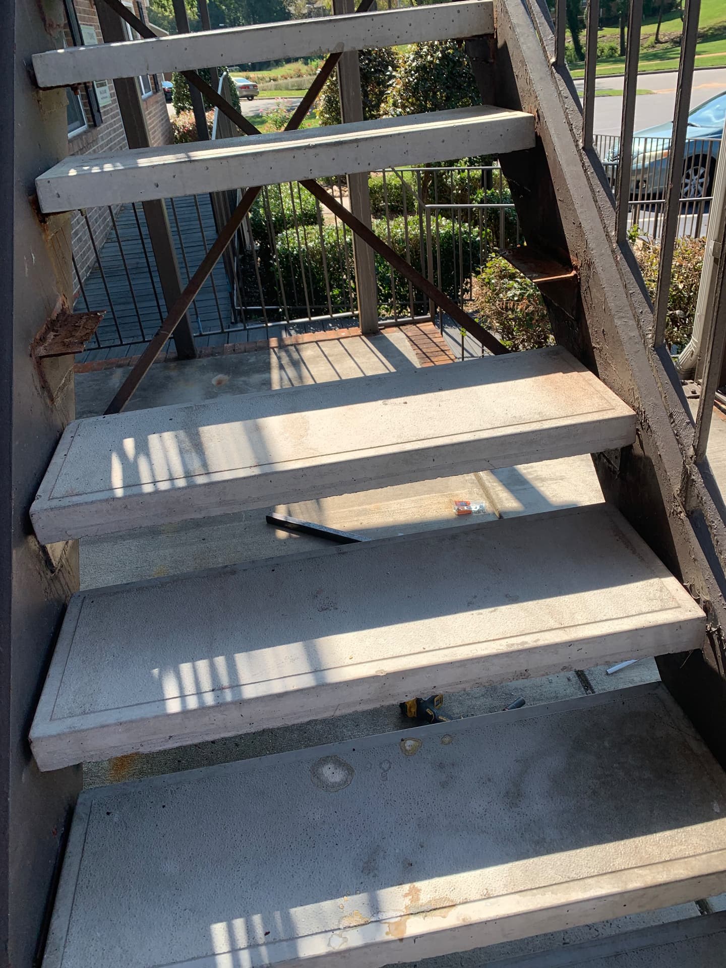 Existing exterior concrete stair treads and steel framing